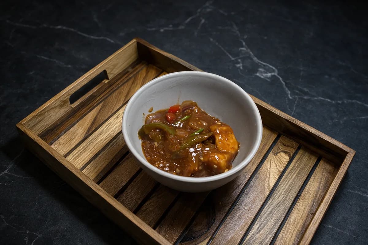 A small bowl of chilli chicken (Add Chicken Scoop)