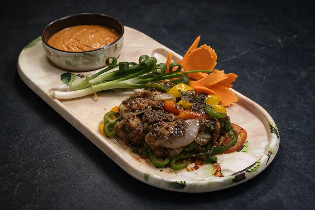 Pepper Glaze Chilli Chicken: cracked black-pepper crust with onion and peppers