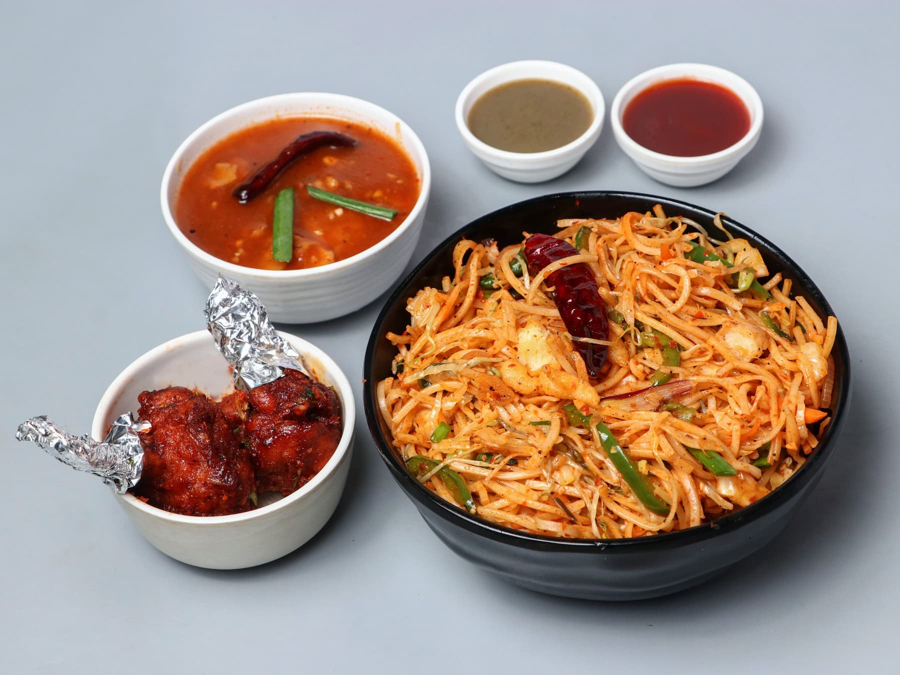 Schezwan noodles combo with lollipop, gravy and dips